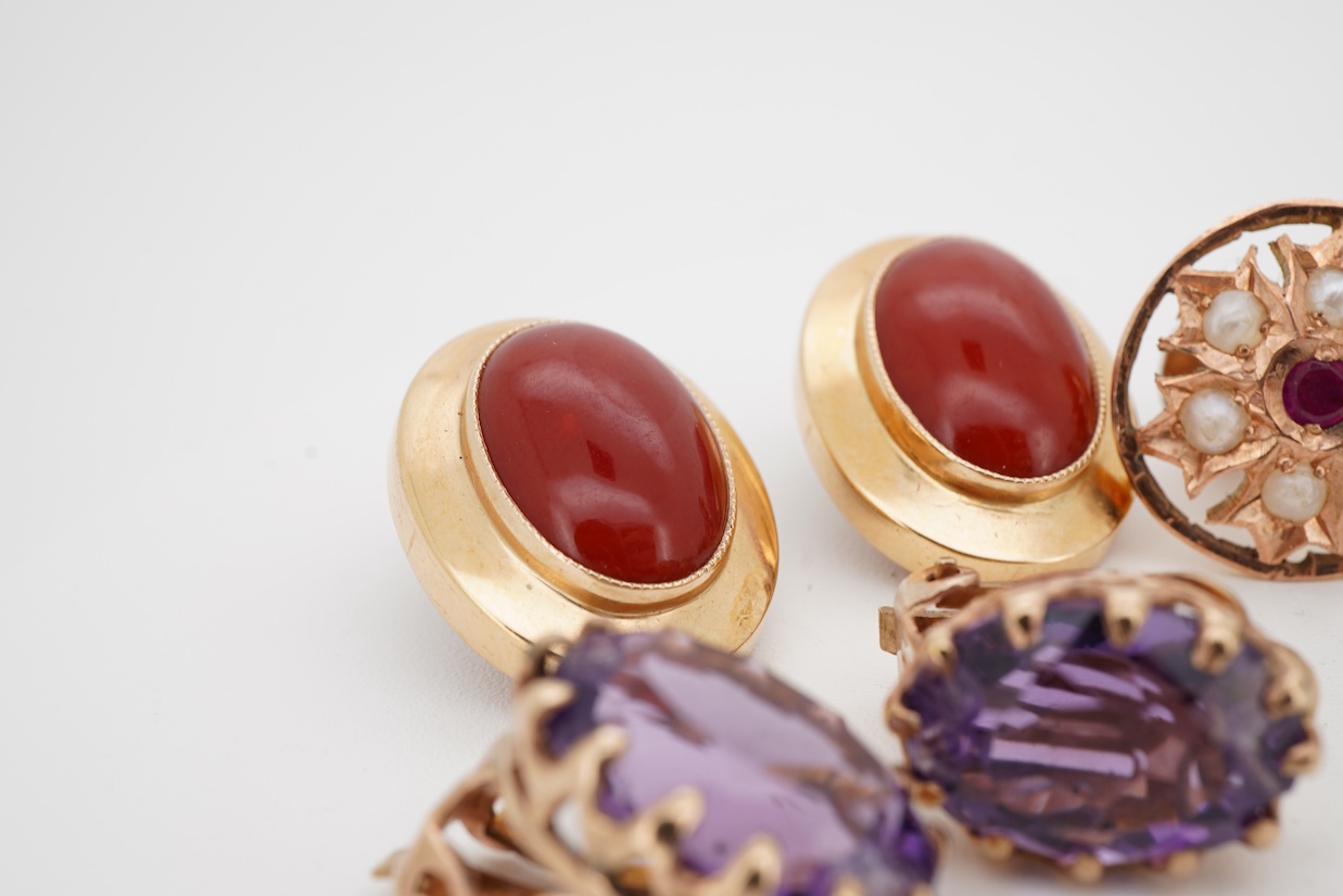 Three assorted modern pairs of ear clips including oval 750 yellow metal and carnelian, 19mm, unmarked yellow metal synthetic ruby and seed pearl and unmarked yellow metal and amethyst, together with a pair of 9ct and so